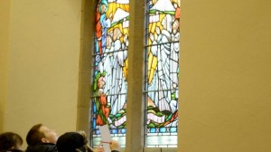 Young pupils admire historic stained glass windows